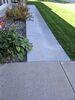 Sinking Concrete Apron by Garage Repaired in Oshkosh, WI - Photo 1