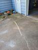 Cracked and Sinking Concrete Driveway Repaired in Oshkosh, WI - Photo 1