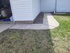 Concrete Patio and Walkway Lifted & Repaired in Two Rivers, WI - Photo 1