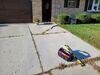 Severely Cracked, Failing Concrete Driveway Lifting, Sealing & Repair in Green Bay, WI - Photo 1