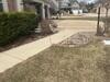 Concrete Driveway, Sidewalk, and Garage Floor Lifted and Repaired in Green Bay, WI - Photo 1