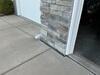 Sunken and Cracked Concrete Driveway Repaired by Contractor in Green Bay, WI - Photo 1