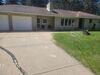 Severely Damaged Concrete Driveway and Walkway Lifted and Cracks Sealed in Schofield, Wisconsin - Photo 6