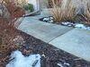 Sunken Concrete Driveway & Sidewalk Lifted, Sealed & Repaired in Sturgeon Bay, Wisconsin - Photo 5