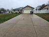 Sunken Concrete Driveway & Sidewalk Lifted with PolyLevel Foam in Marshfield, WI - Photo 1