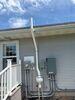 Iowa Homeowner Takes Action Against High Radon Levels with Mitigation System - Photo 1