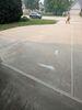 Cracked and Sunken Concrete Driveway Repair in De Pere, WI - Photo 1