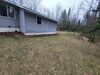 Sloped & Settled Home Addition Saved with Foundation Pier System Installation in Menominee, MI - Photo 3