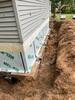 Sloped & Settled Home Addition Saved with Foundation Pier System Installation in Menominee, MI - Photo 2