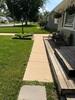 Porch Protection & Sidewalk Leveling: PolyLevel® Stabilization in Cedar Rapids, IA - Photo 1