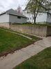 Foundation Repair Utilized on Poured Concrete Retaining Wall in Berlin, WI - Photo 1