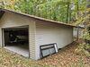 Sunken Garage Foundation Repair Using Push Piers in Rhinelander, WI - Photo 1