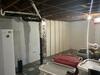 Bowing Foundation Walls Stabilized and Basement Waterproofed in Oshkosh, WI - Photo 1
