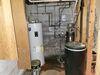 Wet Basement Repair with Battery Back-up Sump Pump and Drainage System in Merrill, WI - Photo 1