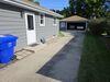 Sunken and Cracked Concrete Driveway Repaired in Appleton, WI - Photo 1