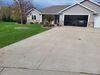 Sunken and Cracked Concrete Driveway Repaired in Menasha, WI - Photo 1