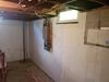 Bowing Basement Foundation Wall Repaired with GeoLock Anchors in Hortonville, WI - Photo 1