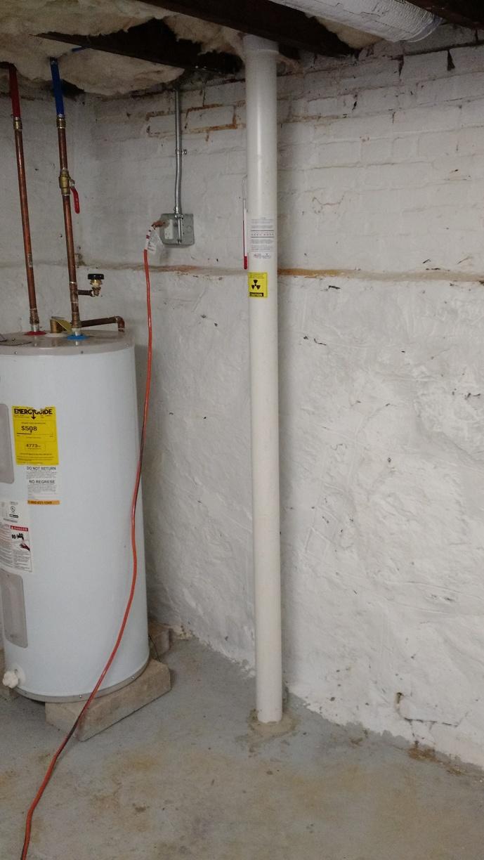 Radon Gas Mitigation - Newburyport, MA Radon - Radon pipe in basement