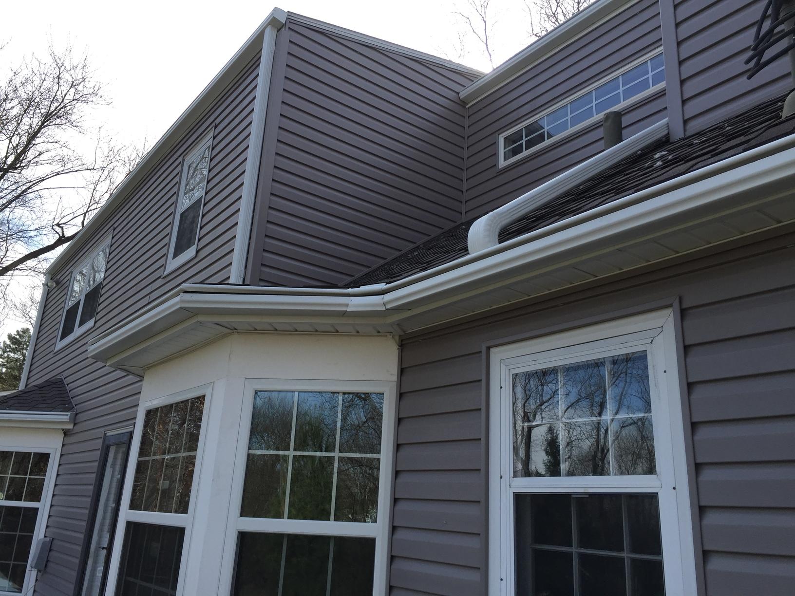White LeafGuard Gutters Installed on Beautiful Home in Omaha White