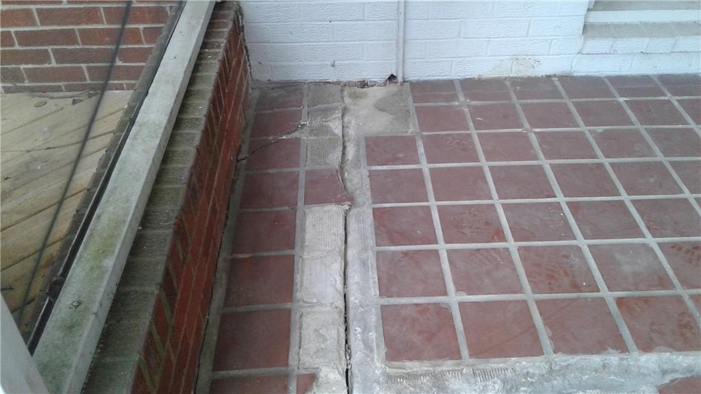 Concrete Lifting and Leveling Sinking porch slab in Wilmington Delaware Sinking Slab