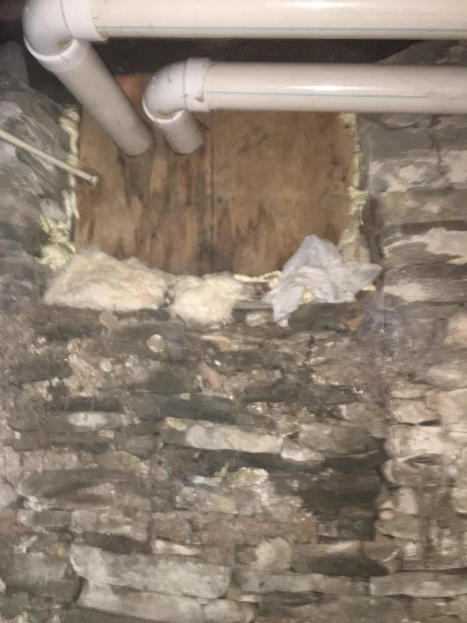 Insulation Services Stone Wall Foundation Insulated with Spray Foam