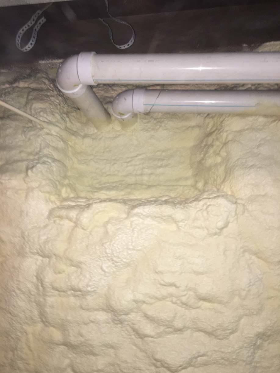 Insulation Services Stone Wall Foundation Insulated with Spray Foam