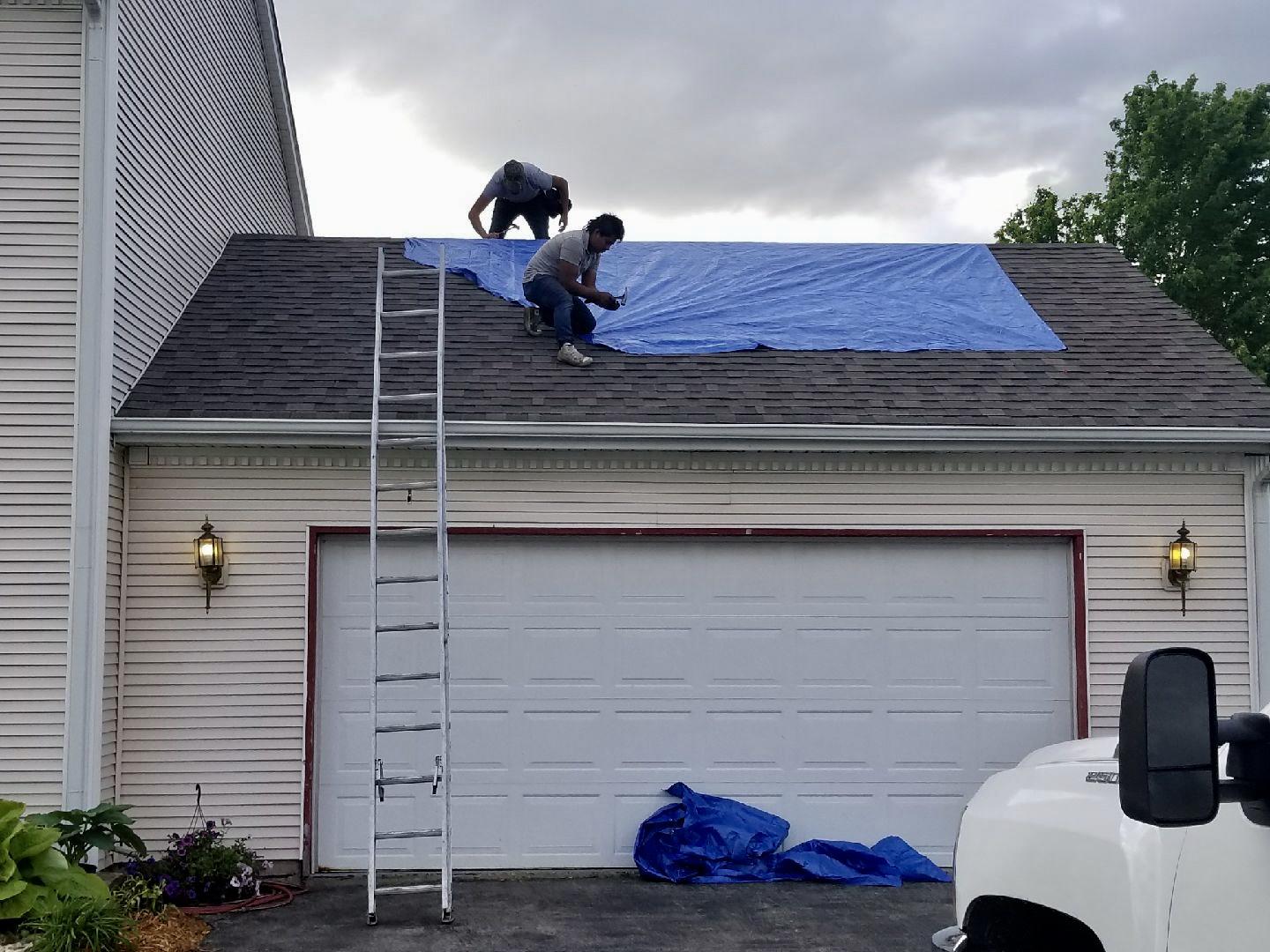 Roof Replacement in Roscoe, IL Tarp installed above garage.
