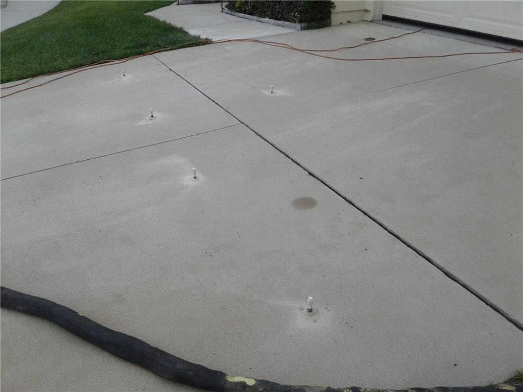 Concrete Lifting & Leveling PolyLevel Concrete Injection in Driveway
