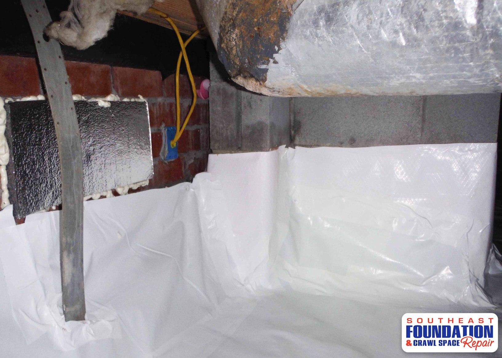 Crawl Space Repair Installing a CleanSpace Encapsulation System in Dillion, SC Sealing Off Vent