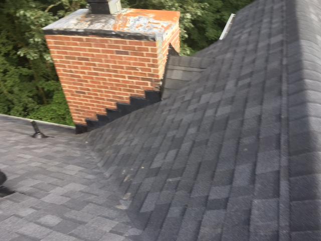 Roof Replacement In Brentwood With Owens Corning Onyx Black Chimney After Cricket Installation In Brentwood