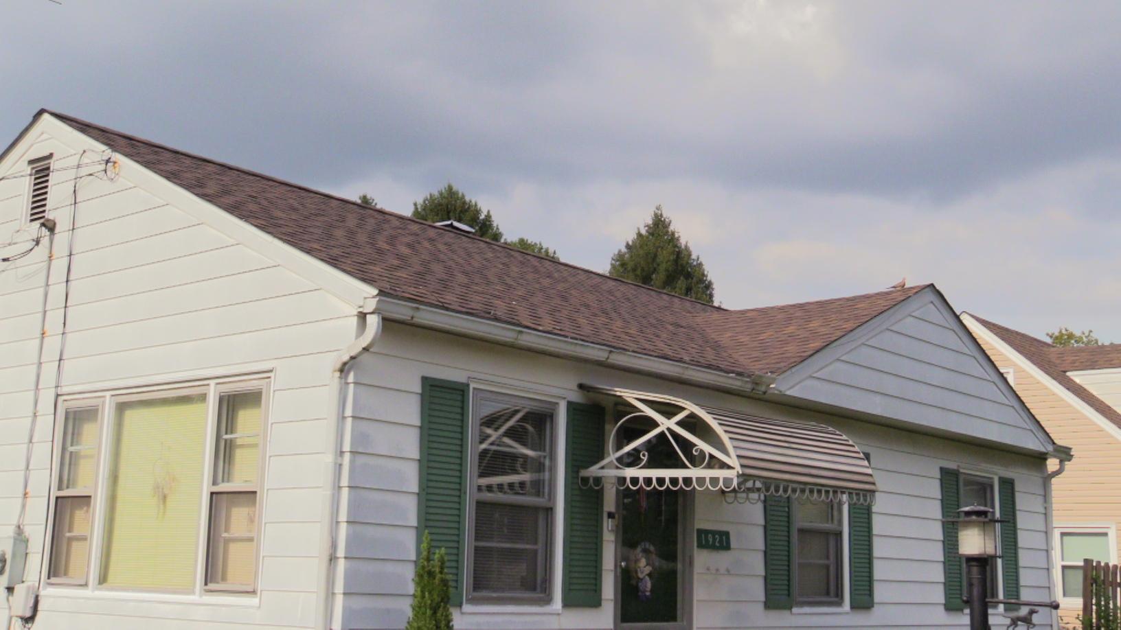 A New Shingle Roof Installed By Pinnacle Exteriors Left A New Shingle Roof Installed By Pinnacle Exteriors Left