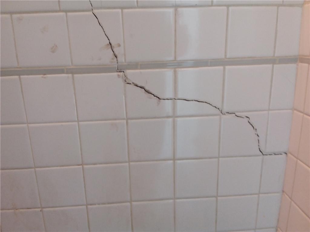 tile bathroom crack cracks fix foundation settling piers