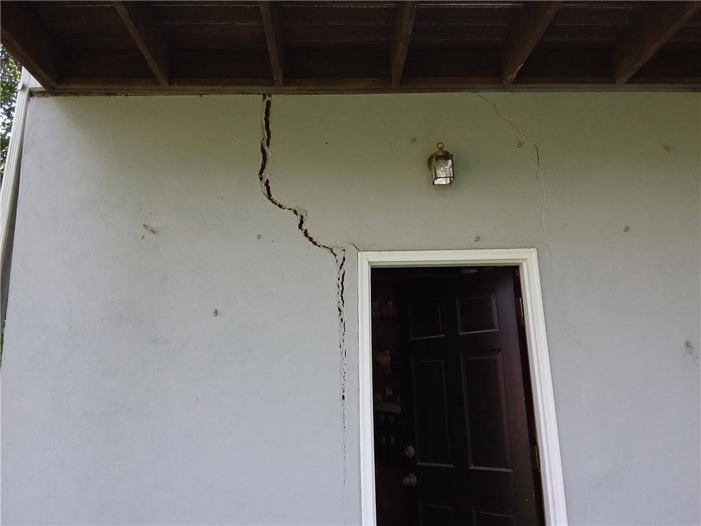 Home Foundation Repair Tree Roots Crack Foundation in Macon, GA Large Door Cracks