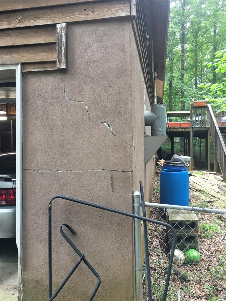 Home Foundation Repair Piers Fix Cracking Garage Wall in Macon, GA Exterior Crack