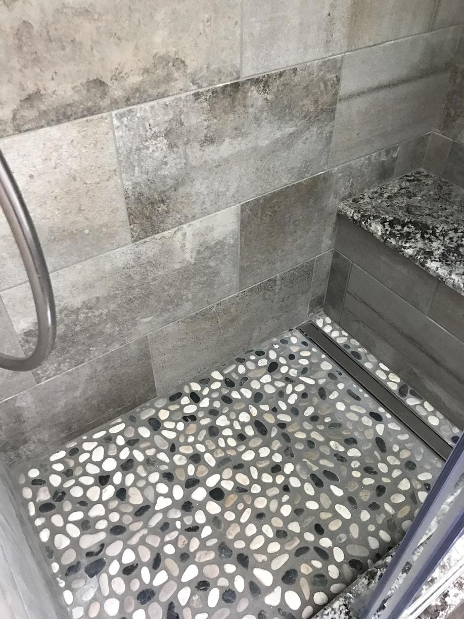 Is A Pebble Shower Floor A Good Idea / Neutral and Black Mosaic Pebble