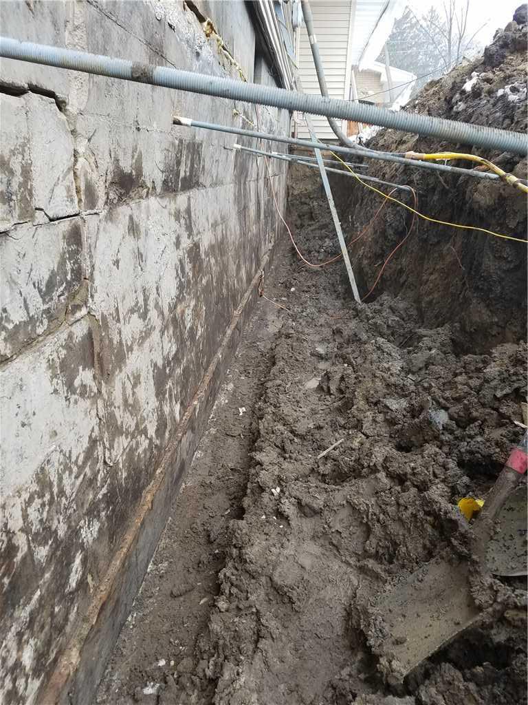 Foundation Repair Stabilizing a Severely Bowing Wall in St. Joseph