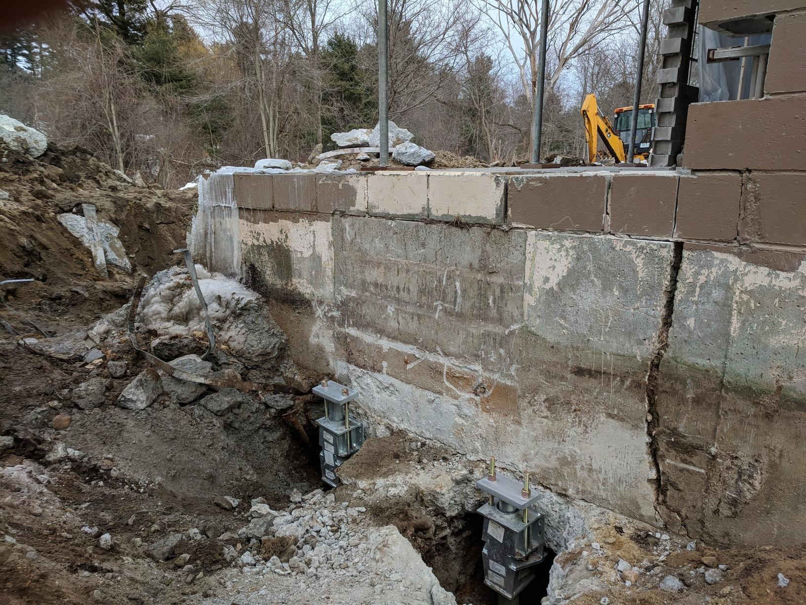 Cracked and Settling Foundation Causes Wall Collapse - View of crack