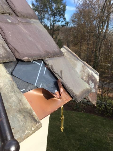 Installing Copper Gutters On A Slate Roof In Somerville Ma Closeup On The Gutter Hangers
