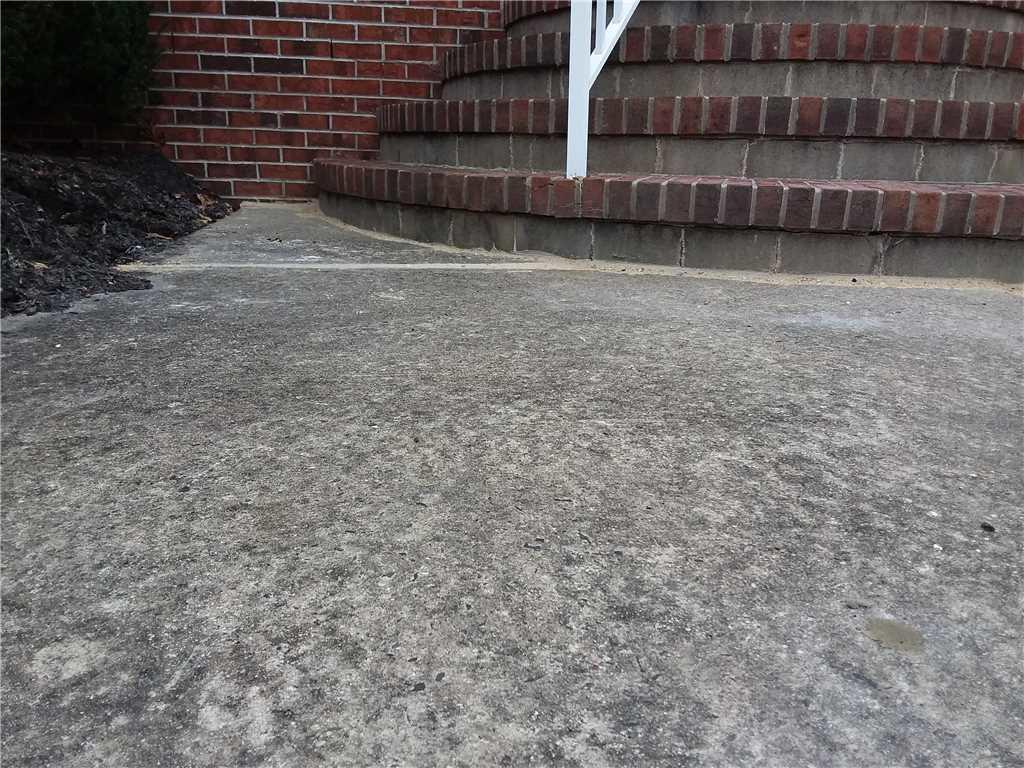 Concrete Lifting and Leveling Concrete Slab Sinking 2 Inches in Jackson, NJ Concrete Slab