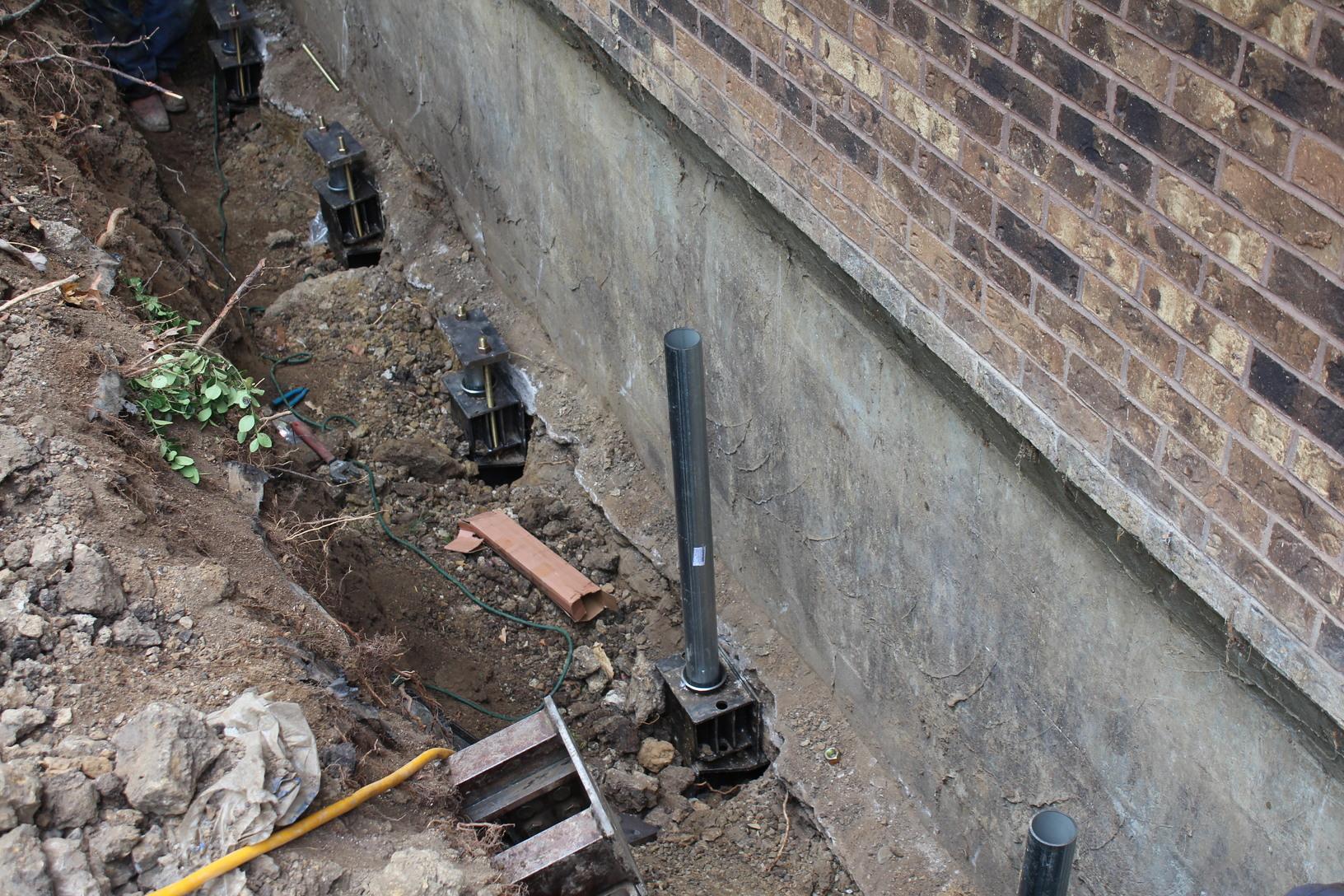 Foundation Repair Push Piering a Foundation in Des Moines, IA Steel