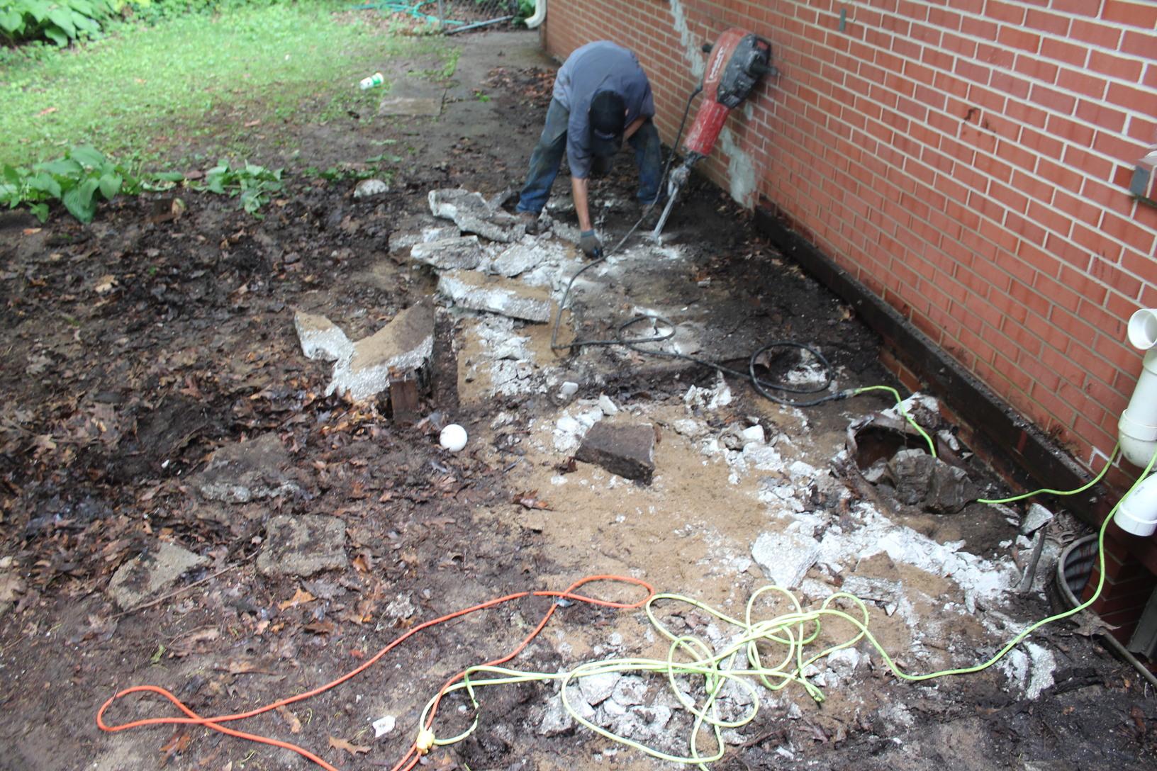 Foundation Repair Des Moines Foundation Piering Job Tearing up the