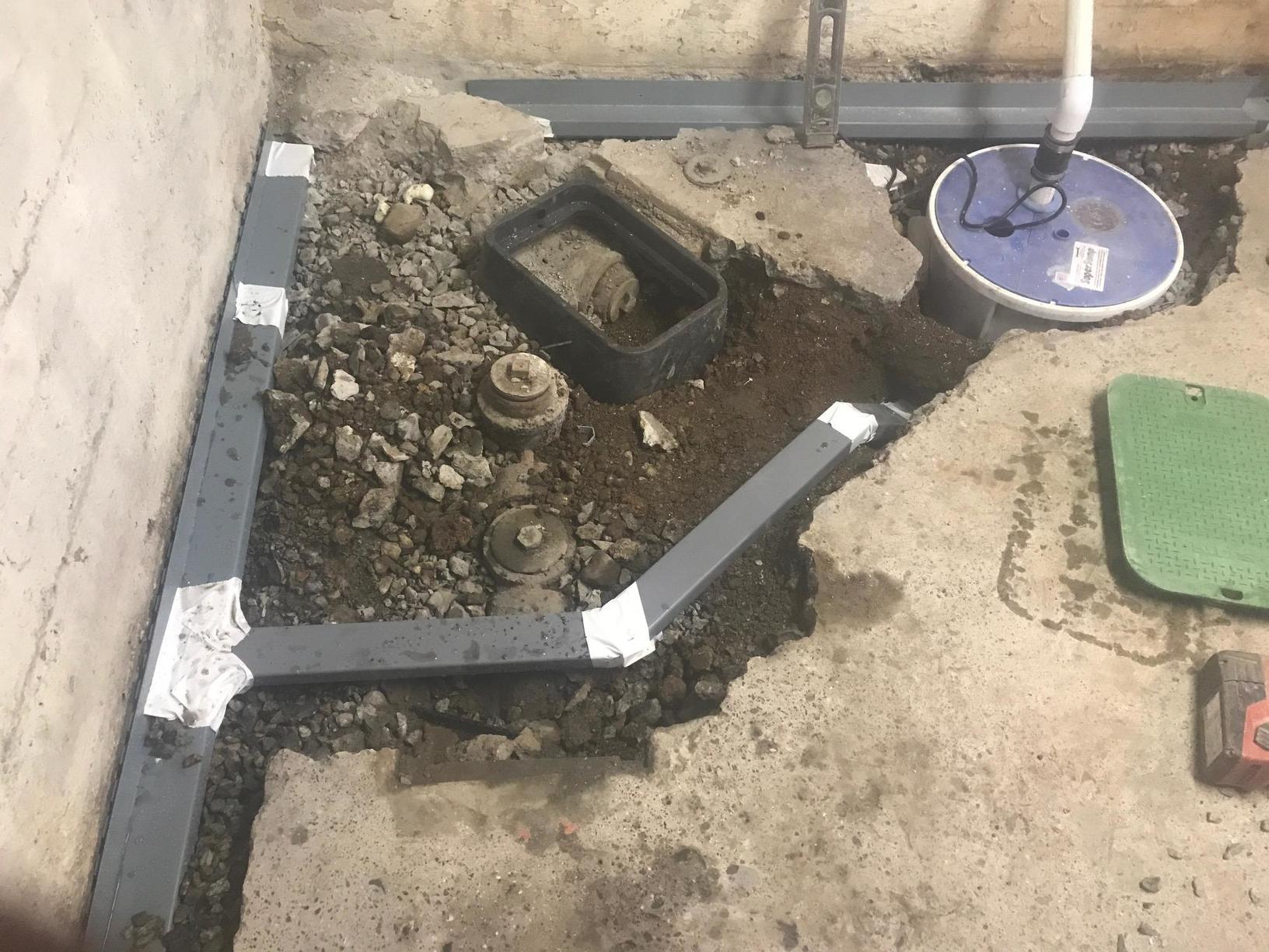 Sump Pumps Milton, MA Home Gets Waterproofed Digging for the SuperSump