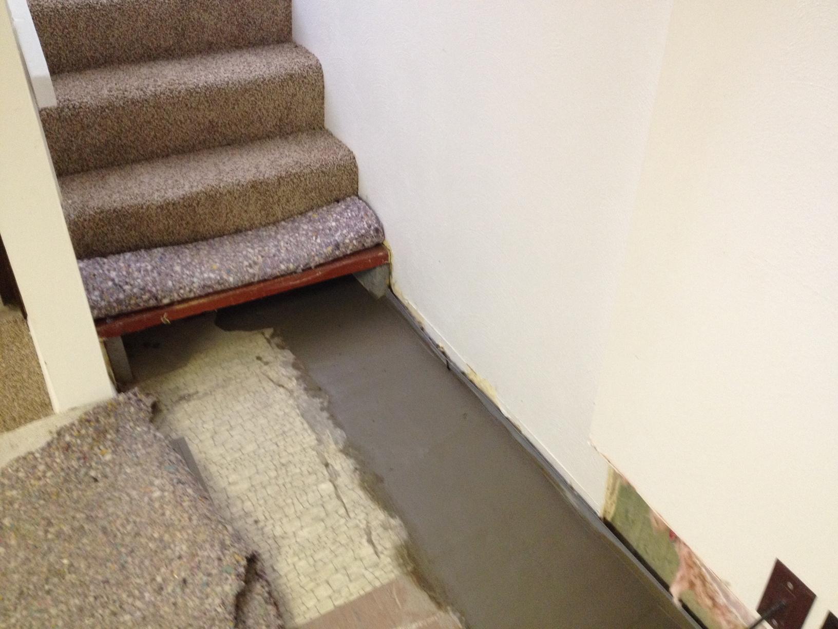 Basement Waterproofing Double System in Affton, MO Waterproofing Under the Stairs