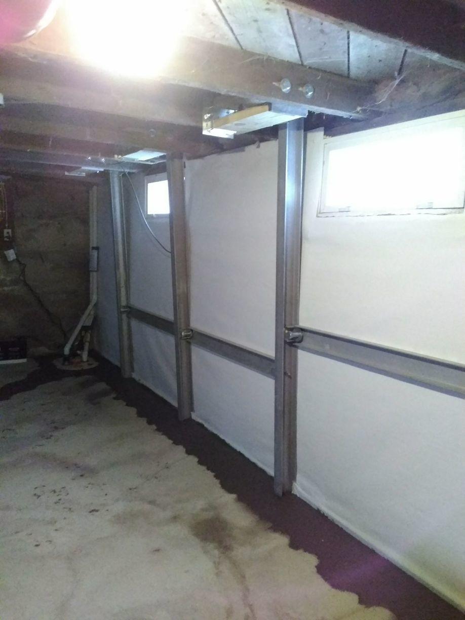 Foundation Repair Failing Foundation And Wet Basement Restored In Lyle Mn Powerbraces Installed To Repair Bowing Walls