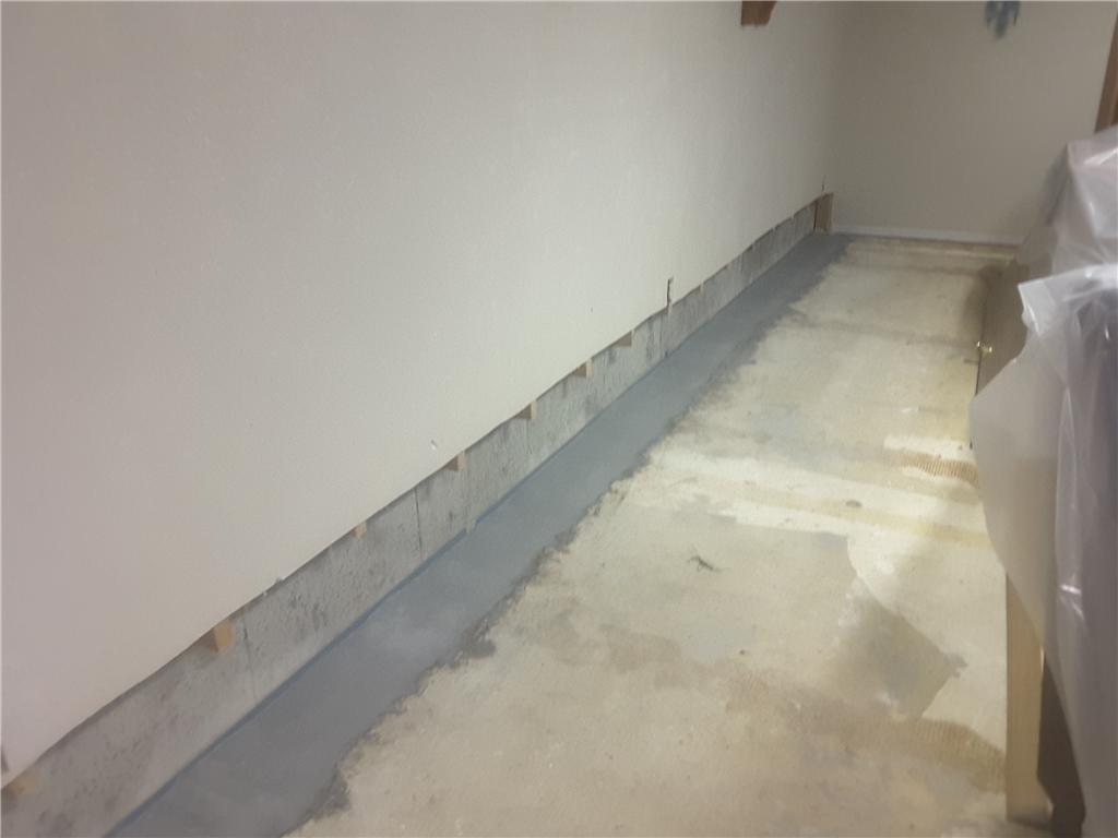 Basement Waterproofing WaterGuard™ Behind a Finished Wall The