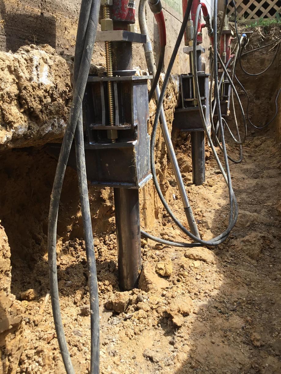Crawl Space Repair Helical Piers used to stabilize a foundation in
