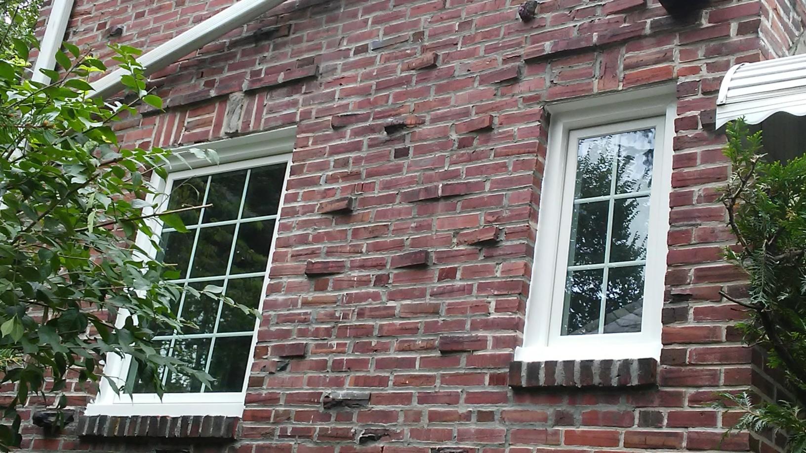Replacement Windows Installing Infinity Windows On Home In Philadelphia Pa Marvin Infinity Windows With White Finish Installed On Brick Siding