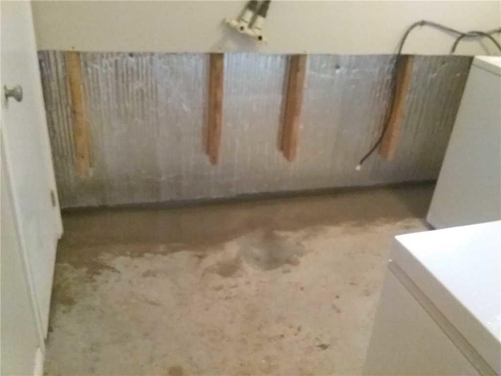 Basement Waterproofing Freshening Up a Laundry Room in St. Mary's, ON
