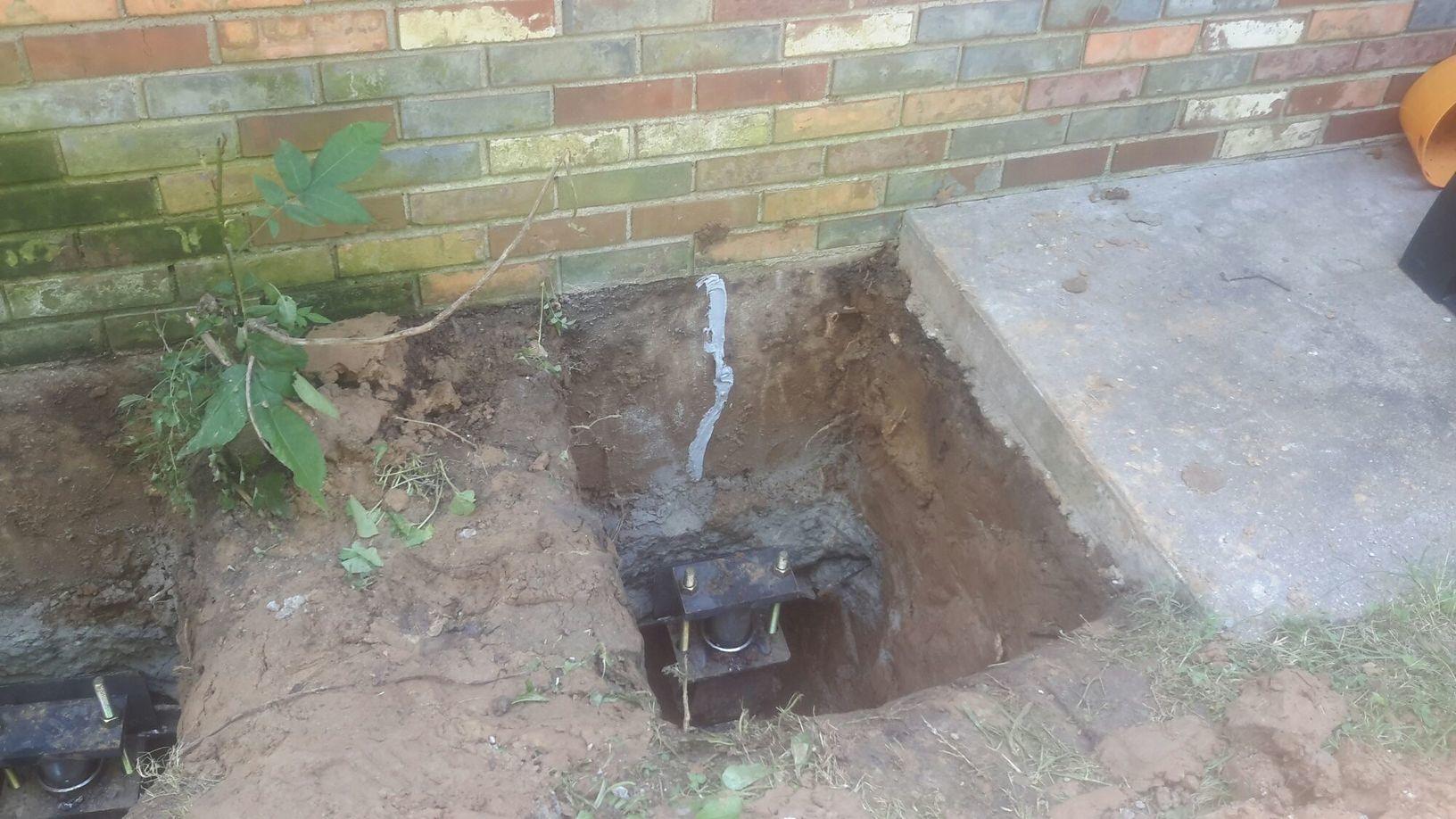 Foundation Repair Stopping Foundation Settlement Installing PushPiers