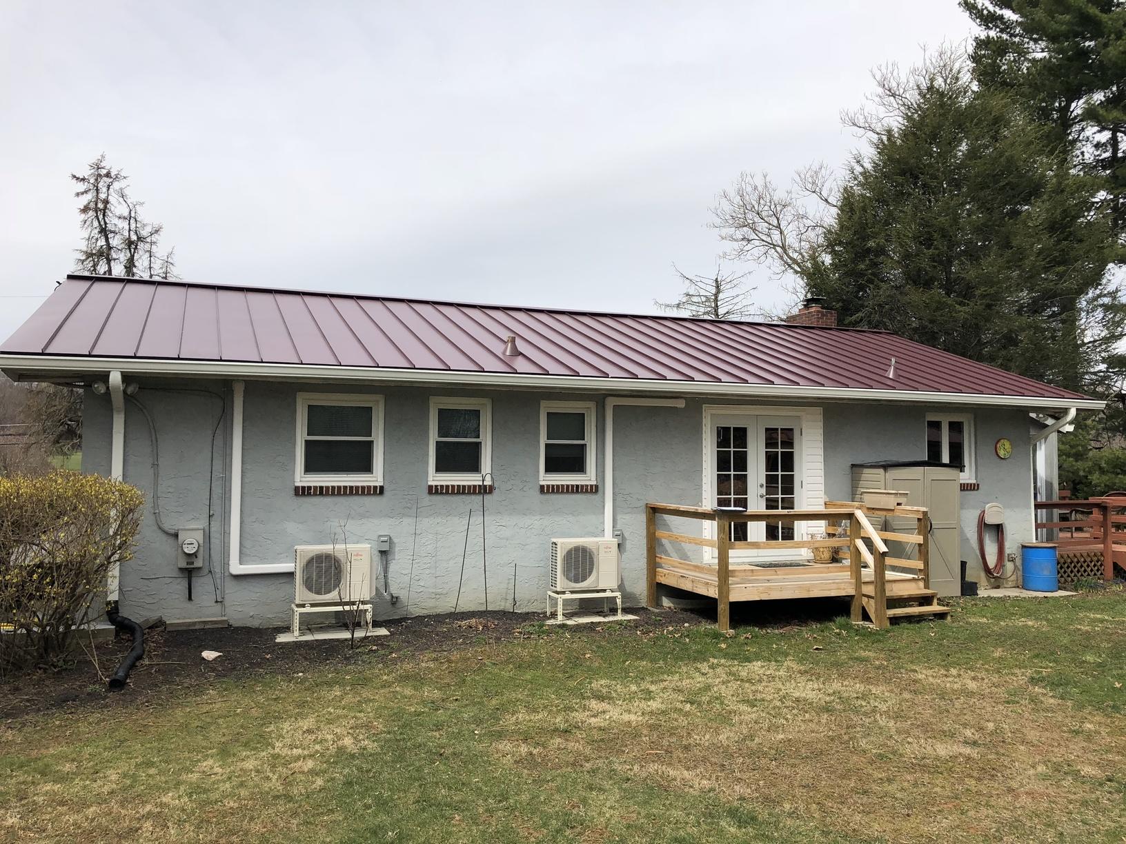 Roof Replacement Installing Metal Roof with Burgundy